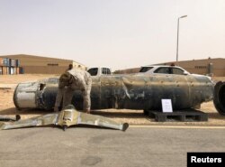 FILE - A projectile and a drone launched at Saudi Arabia by Yemen's Houthis are displayed at a Saudi military base, Al-Kharj, Saudi Arabia, June 21, 2019.