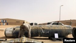 FILE - A projectile and a drone launched at Saudi Arabia by Yemen's Houthis are displayed at a Saudi military base, Al-Kharj, Saudi Arabia, June 21, 2019. 
