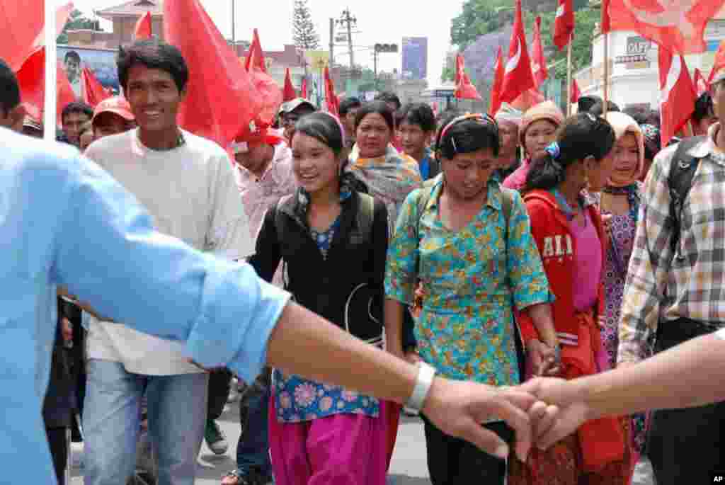 Demonstrators march to rally site