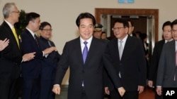 FILE - Taiwanese President Lai Ching-te smiles to the media as he departs for South Pacific at Taoyuan International Airport in Taoyuan, Taiwan, Nov. 30, 2024.