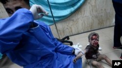 Povređeno dete u bolnici u Pojasu Gaze (Foto: AP/Adel Hana)