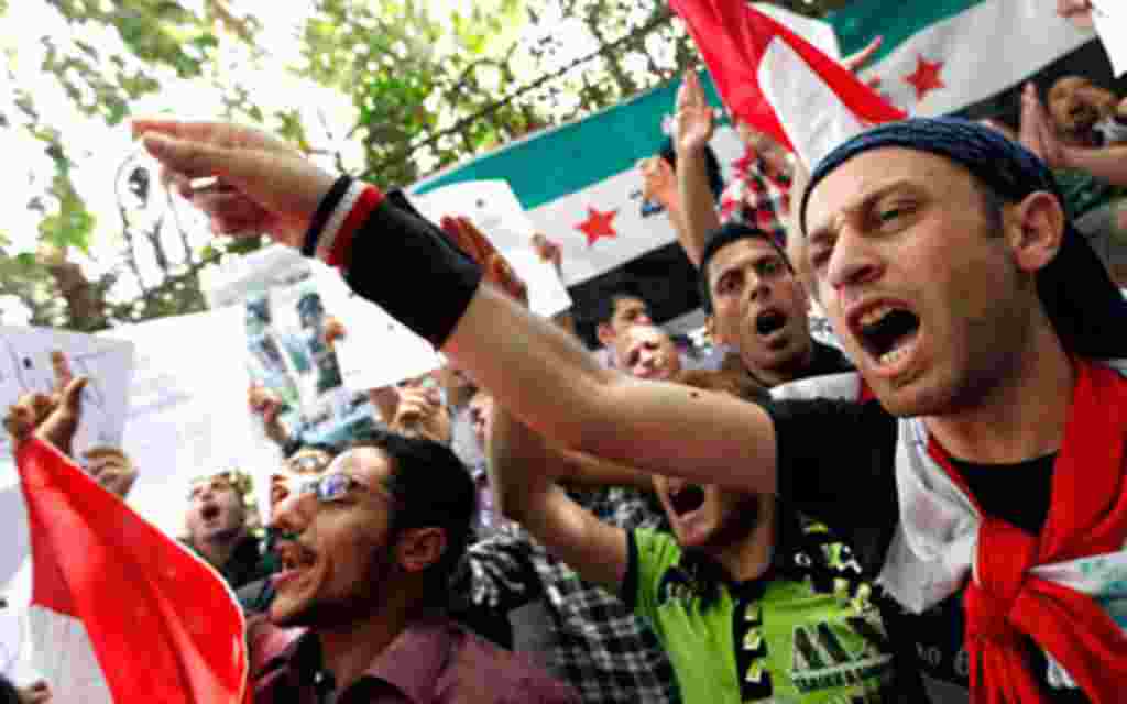 Demonstrators chant slogans during a protest demanding the ouster of the Syrian government, in front of the Syrian embassy in Cairo April 26, 2011