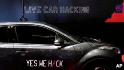 FILE - A Toyota Hybrid is seen during a test for hackers at the Cybersecurity Conference in Lille, France, Jan. 29, 2020.