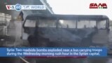 VOA60 World - Bomb Attack on Syrian Army Bus in Damascus Kills at Least 14