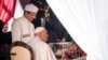 Pope Francis, right, receives a miniature model of the Istiqlal Mosque as the Grand Imam of Istiqlal Mosque Nasaruddin Umar, left, looks on during an interreligious meeting with religious leaders at the Istiqlal Mosque in Jakarta, Sept. 5, 2024. 