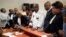 FILE - Accompanied by his wife and his lawyers, Congo opposition candidate Martin Fayulu, center, petitions the constitutional court following his loss in the presidential elections in Kinshasa, Congo, Jan. 12, 2019. 