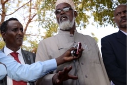 FILE - Ahmed Mohamed Madobe, leader of the Ras Kamboni militia, speaks during a meeting for the creation of a State of Jubaland in Kismayo, Somalia, Feb. 28, 2013.