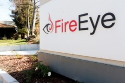 FILE - Security firm FireEye's logo is seen outside the company's offices in Milpitas, California.
