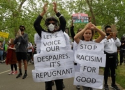 Protesters take part in a demonstration on June 3, 2020, in Hyde Park, London, over the death of George Floyd, a black man who died after being restrained by Minneapolis police officers on May 25.