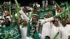 FILE - Saudi Arabian fans celebrate during a World Cup Asian qualifying playoff soccer match between Saudi Arabia and Bahrain at King Fahd Stadium in Riyadh, Saudi Arabia, Sept. 9, 2009.