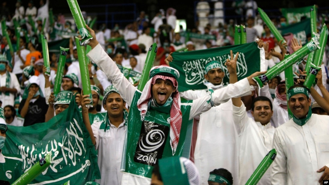 FILE - Saudi Arabian fans celebrate during a World Cup Asian qualifying playoff soccer match between Saudi Arabia and Bahrain at King Fahd Stadium in Riyadh, Saudi Arabia, Sept. 9, 2009.