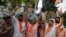 Supporters of Vishwa Hindu Parishad (VHP) or World Hindu council celebrate the Supreme Court's verdict, outside the VHP office in Ahmadabad, India, Nov. 9, 2019. 