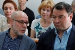 Former head of Moscow’s Gogol Center theater, Alexei Malobrodsky, and general director of Serebrennikov's "Seventh Studio" company, Yury Itin attend a court hearing in Moscow, May 21, 2018.