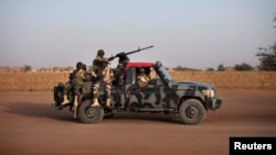 Malian soldiers patrol the streets of Gao, February 20, 2013. 