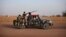 Malian soldiers patrol the streets of Gao, February 20, 2013. 