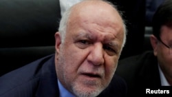 FILE - Iran Oil Minister Bijan Zanganeh talks to journalists at the beginning of an OPEC meeting in Vienna, Austria, June 22, 2018. 
