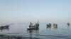 FILE - Fishermen get ready to cast off in the morning off the coast of Joal, Senegal, May 30, 2017. (R. Shryock/VOA)