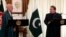 Pakistan's Prime Minister Nawaz Sharif (R) speaks during a joint news conference as Afghan President Hamid Karzai listens at the prime minister's residence in Islamabad, Aug. 26, 2013.