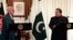 Pakistan's Prime Minister Nawaz Sharif (R) speaks during a joint news conference as Afghan President Hamid Karzai listens at the prime minister's residence in Islamabad, Aug. 26, 2013.