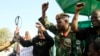 (FILE) Sudanese army officials greet the crowd during a meeting with the city's governor supporters and members of the Sudanese armed popular resistance, which supports the army, in Gedaref, Sudan, on January 16, 2024.