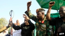 (FILE) Sudanese army officials greet the crowd during a meeting with the city's governor supporters and members of the Sudanese armed popular resistance, which supports the army, in Gedaref, Sudan, on January 16, 2024.