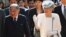 Japan's Emperor Akihito, left, and Empress Michiko walk into the compound of the memorial house of Vietnam's nationalist Phan Boi Chau (1867-1940) who campaigned for a strong relationship with Japan to gain Vietnam's independence, in the central city of Hue, Vietnam's former imperial city, March 4, 2017.