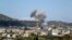 Smoke billows following bombardment by regime forces on the village of Basamis, Idlib province, Syria, May 4, 2019.