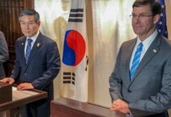 U.S. Defense Secretary Mark Esper, right and South Korea Defense Minister Jeong Kyeong-doo attend a press conference in Bangkok, Nov. 17, 2019. Mark Esper and his South Korean counterpart announced the delay of U.S.-South Korea military exercises.