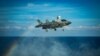 A U.S. Marines F-35B Lightning II fighter aircraft prepares to land on the flight deck in the South China Sea.