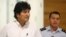 Bolivian President Evo Morales (L) is accompanied by his aide-de-camp at the Vienna International Airport in Schwechat, July 3, 2013. 