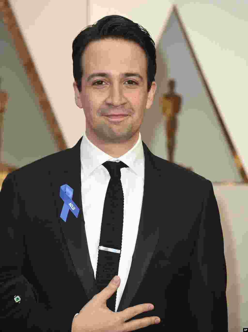 Lin-Manuel Miranda wears an ACLU ribbon as he arrives at the Oscars on Sunday, Feb. 26, 2017, at the Dolby Theatre in Los Angeles.