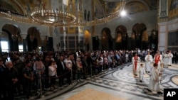People attend the traditional Orthodox Easter Liturgy in the St. Sava temple in Belgrade, Serbia, May 2, 2021. 
