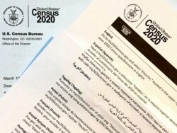 A 2020 census letter and a multilingual guide mailed to a U.S. resident in Fairfax, Virginia, March 12, 2020. (Photo: Diaa Bekheet)