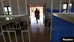 FILE - A patient enters the men's dormitory of the Physical Rehabilitation Reference Centre in Juba, South Sudan, July 7, 2011. 