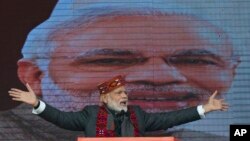 FILE - Indian Prime Minister Narendra Modi addresses a political gathering of his Bharatiya Janata Party, in Himachal Pradesh, in Dharmsala, India, Dec. 27, 2018.