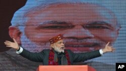 FILE - Indian Prime Minister Narendra Modi addresses a political gathering of his Bharatiya Janata Party, in Himachal Pradesh, in Dharmsala, India, Dec. 27, 2018.