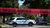FILE - Police tape marks off a Chicago street as officers investigate the scene of a fatal shooting in the city's south side, June 15, 2021. 