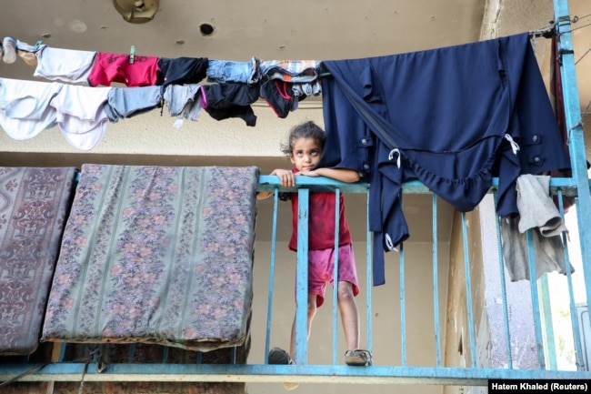 A child looks on at a school where displaced Palestinians shelter, in Khan Younis in the southern Gaza Strip, September 4, 2024. (REUTERS/Hatem Khaled)