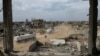 Humanitarian aid trucks enter through the Kerem Shalom crossing from Egypt into the Gaza Strip, in Rafah, Jan. 22, 2025.