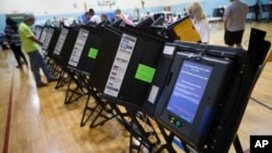 FILE - An electronic voting machine in Columbus, Ohio, Nov. 3, 2015. Democrats and Republicans compete in primaries and caucuses in at least 11 states and one U.S. territory on Tuesday.