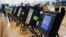 FILE - An electronic voting machine in Columbus, Ohio, Nov. 3, 2015. Democrats and Republicans compete in primaries and caucuses in at least 11 states and one U.S. territory on Tuesday.