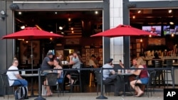 People gather at the North Shore Tavern in Pittsburgh, June 28, 2020.