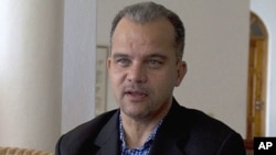 Daniel-Gerard Rouzier speaks during an interview with The Associated Press in Port-au-Prince, Haiti, Wednesday, May 25, 2011