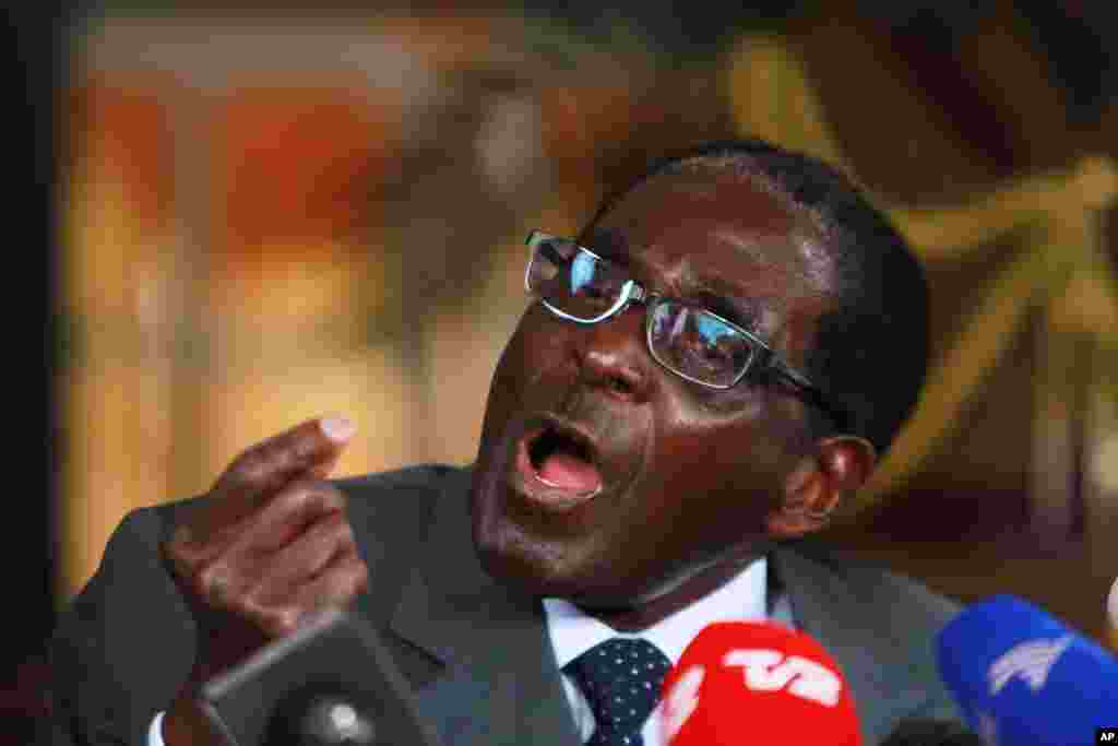 Zimbabwean President Robert Mugabe speaks during a press conference at State House in Harare, Tuesday, July, 30, 2013. Mugabe, who competed against his main rival, Prime Minister Morgan Tsvangirai in the presidential poll said he would accept results of the election.