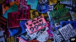 Occupy Wall Street protest buttons are seen in Zuccotti Park, November 11, 2011, in New York.