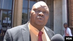 Job Sikhala, the lawyer for former foreign affairs minister Walter Mzembi, talks to reporters after court proceedings where he said charges against his client were "really ridiculous," in Harare, Zimbabwe, Jan 6, 2018. (S. Mhofu/VOA)