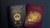 A British National Overseas passports (BNO) and a Hong Kong Special Administrative Region of the People's Republic of China passport are pictured in Hong Kong, Friday, Jan. 29, 2021. 