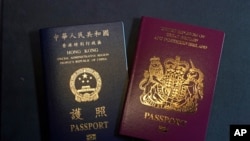 A British National Overseas passports (BNO) and a Hong Kong Special Administrative Region of the People's Republic of China passport are pictured in Hong Kong, Jan. 29, 2021.