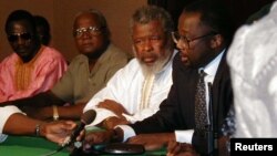 Sierra Leone's rebel leader Foday Sankoh (2nd R) is flanked by senior aides at the formal opening in Lome, Togo of talks with his guerrilla field commanders and United Nations officials on ending Sierra Leone's civil war. Others (from left) are Sankoh's m