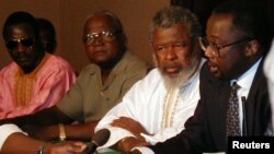 Sierra Leone's rebel leader Foday Sankoh (2nd R) is flanked by senior aides at the formal opening in Lome, Togo of talks. Others (from left) are Sankoh's military adviser General Ibrahim Bah, Solomon "Pa" Rogers and Omrie Golley, (File photo).